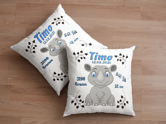 Erinnerungskissen zur Geburt mit Nashorn-Illustration – modernes Design mit einem sitzenden Nashorn in freundlicher Haltung, ergänzt durch klassische Geburtsangaben.