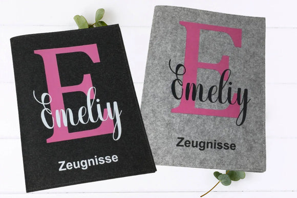 Zeugnismappe mit großem pinkem Buchstaben „E“ und Name – personalisiert für Mädchen, robust aus Filz gefertigt.