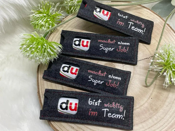 Filzhülle für Mitarbeitergeschenke – Spruch für mehr Zusammenhalt im Team