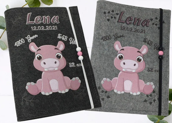 Rosa Nilpferd auf dunkelgrauer U-Heft-Hülle