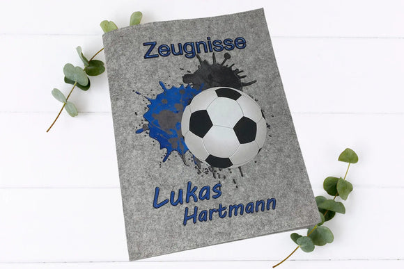 Individuelle Zeugnismappe mit Fußball und Splash-Design in Blau-Schwarz – personalisiert mit
