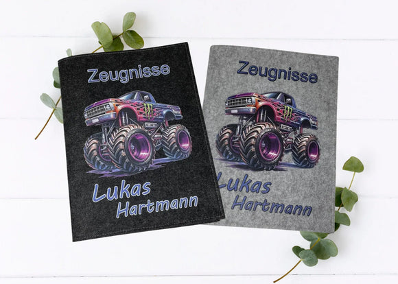 Zeugnismappen aus Filz mit coolem Monstertruck-Motiv und Namensaufdruck in Hellgrau und Dunkelgrau.