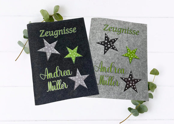 Personalisierte Zeugnismappen mit drei Sternmotiven in Grün, Grau und Schwarz – mit Namensaufdruck , auf Filz in Hell- und Dunkelgrau.